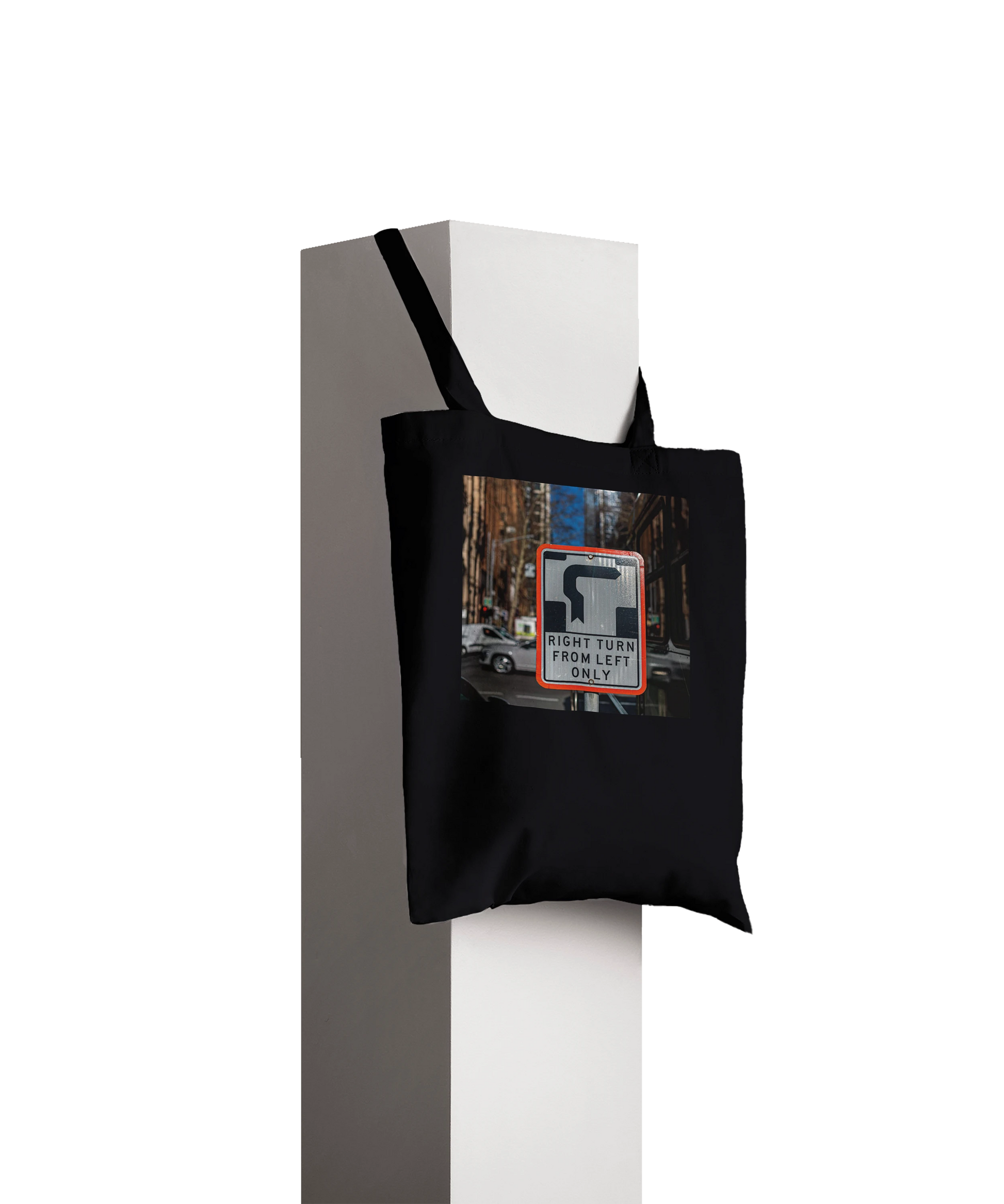 Premium Black Right Turn street sign tote bag displayed hanging on a pillar, product styling shot