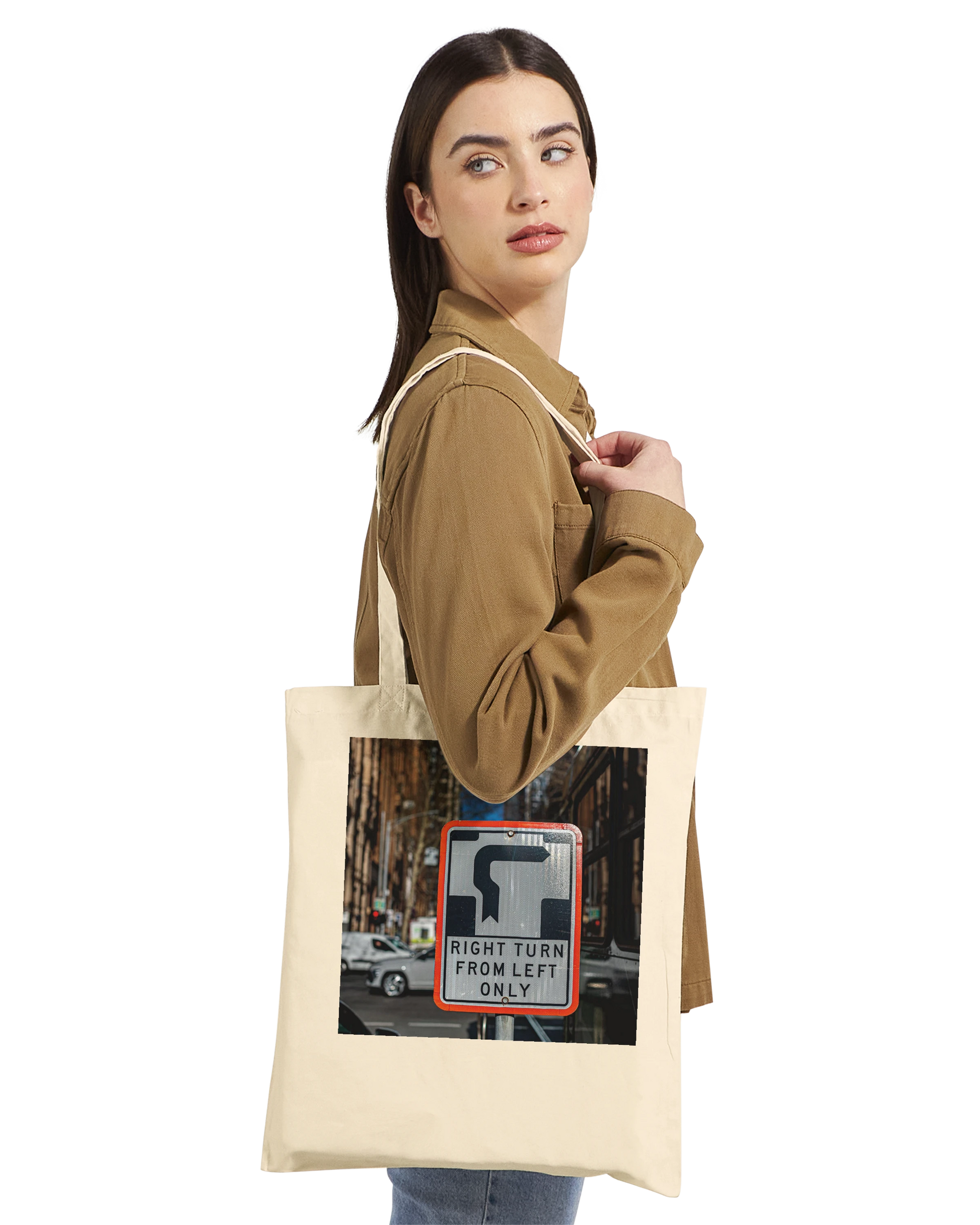Model wearing the Premium Natural Right Turn street sign tote bag, side profile lifestyle shot