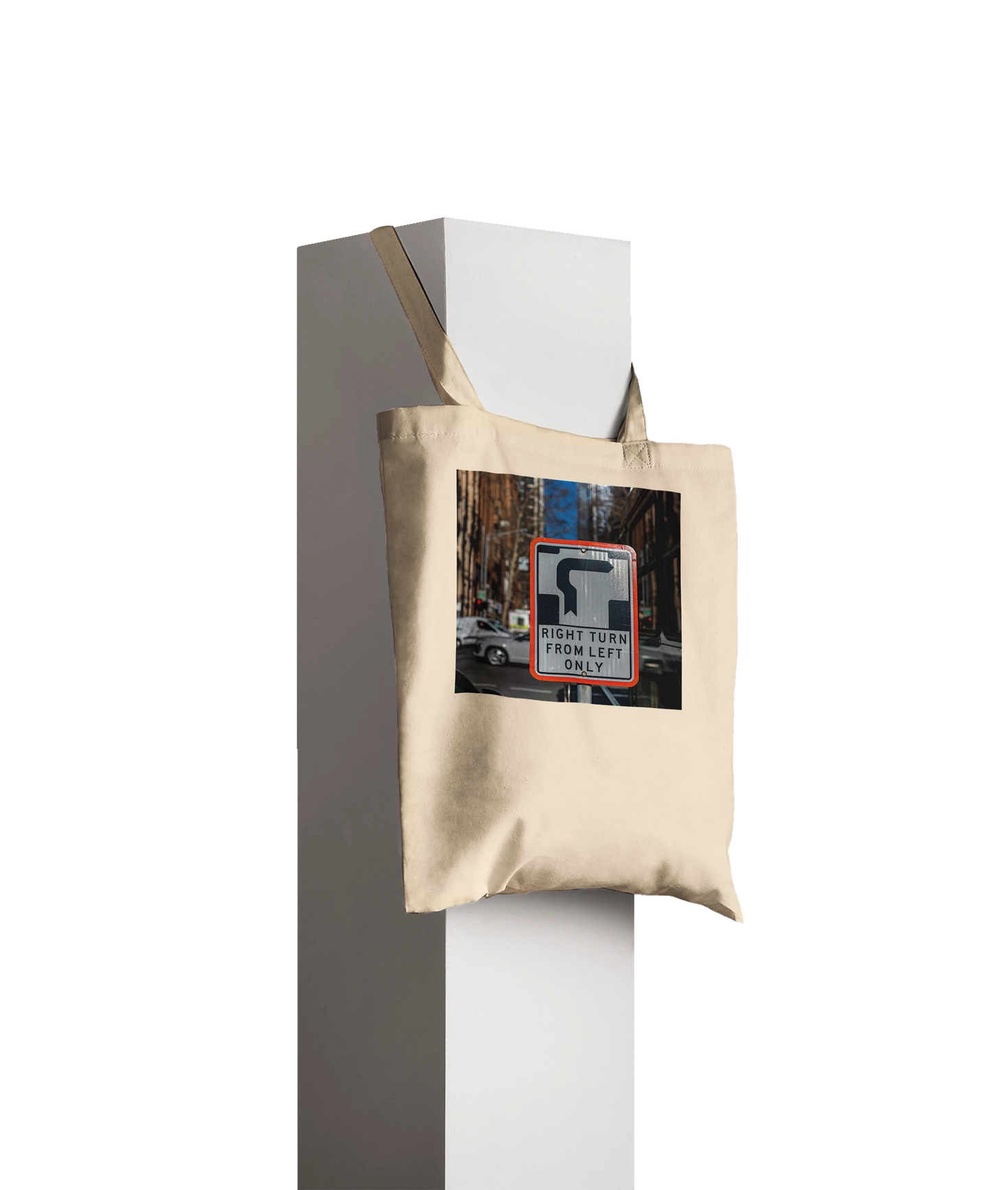 Premium Natural Right Turn street sign tote bag displayed hanging on a pillar, product styling shot