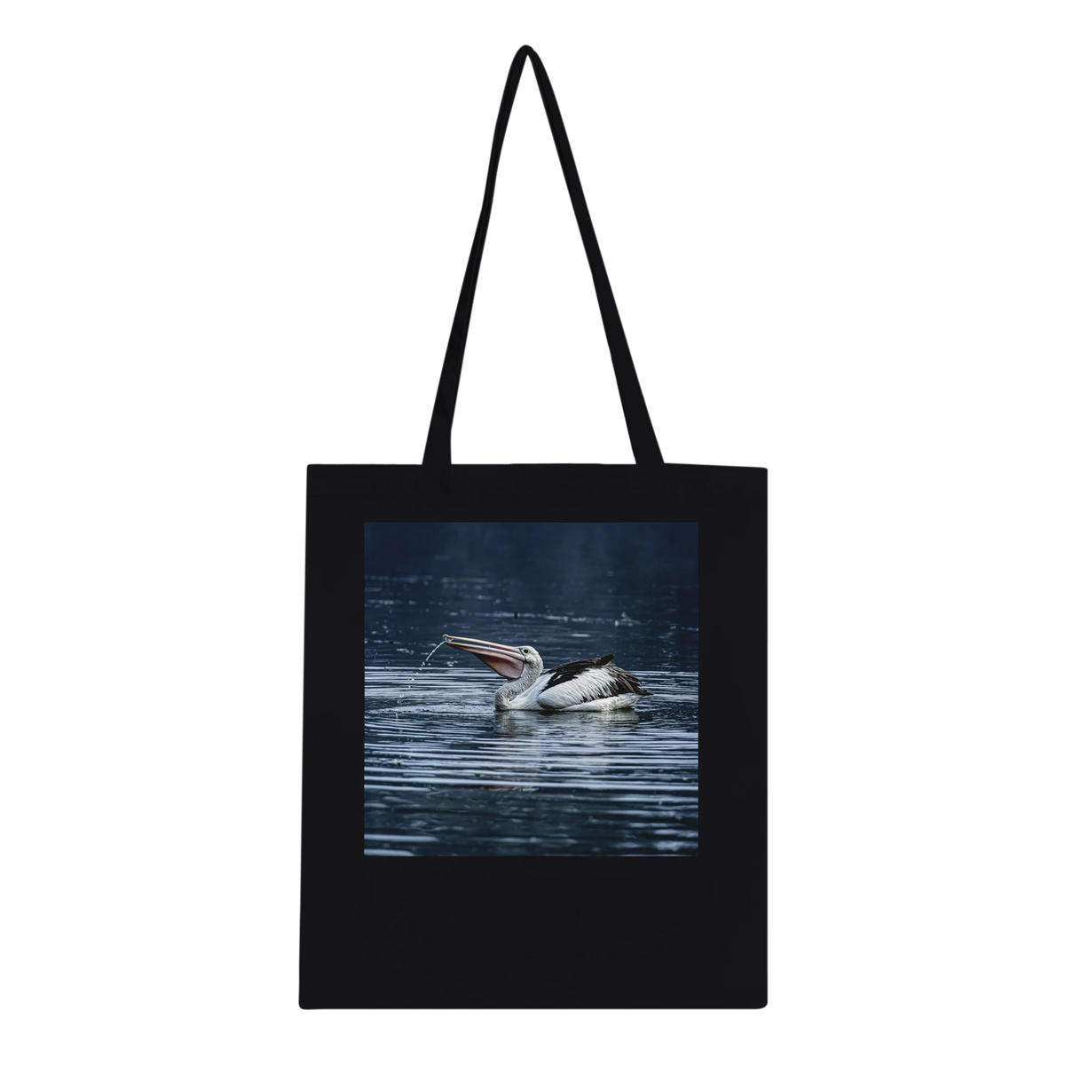 Black tote bag with Australian pelican wildlife photo print, studio mockup