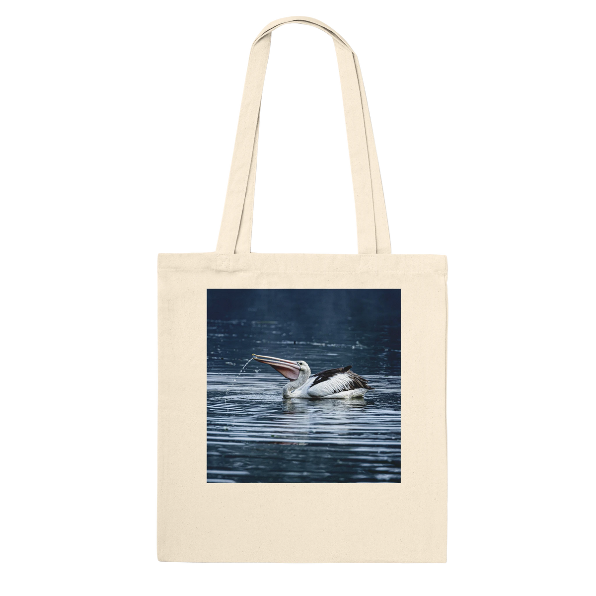 Natural canvas tote bag printed with a splashing pelican photo, front view