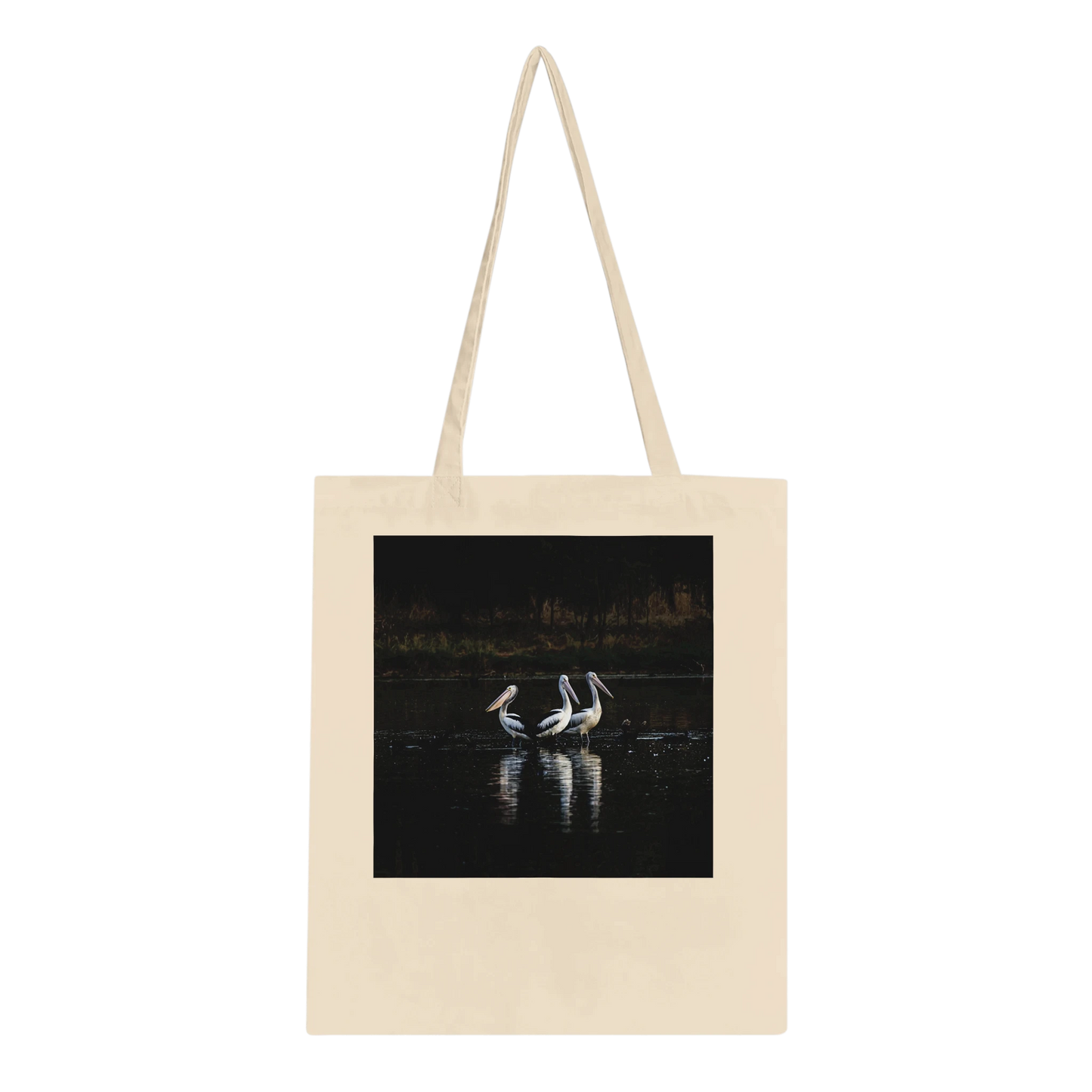 Three Pelicans canvas tote bag laid flat, showing the front design