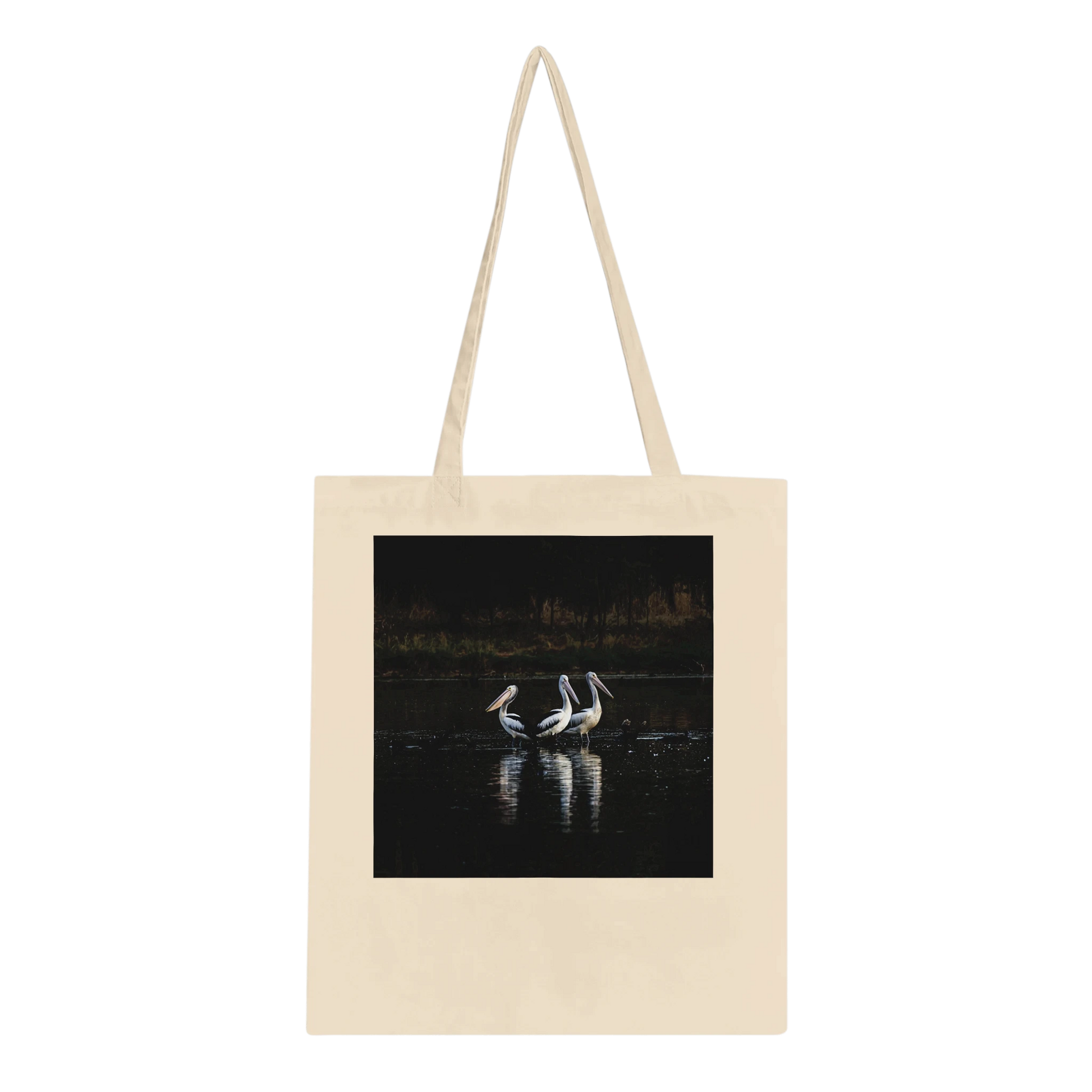Three Pelicans canvas tote bag laid flat, showing the front design