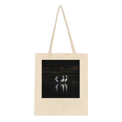 Three Pelicans canvas tote bag laid flat, showing the front design