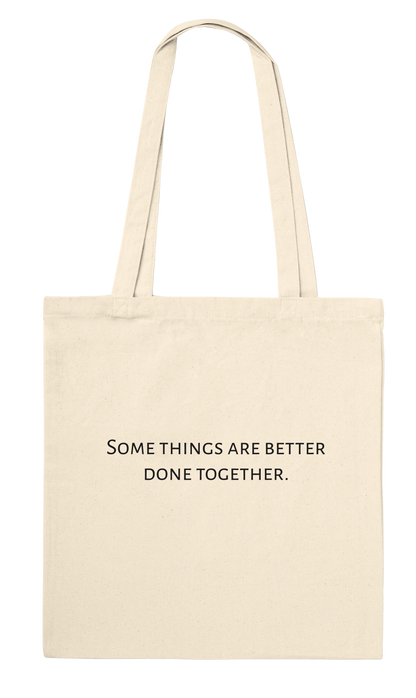 Three Pelicans canvas tote bag, natural, back view with printed quote: Some things are better done together.