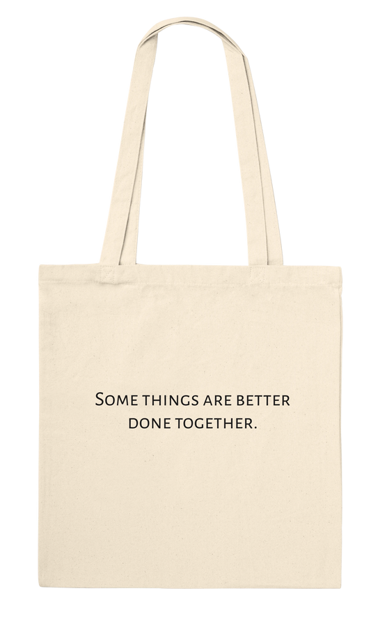 Three Pelicans canvas tote bag, natural, back view with printed quote: Some things are better done together.
