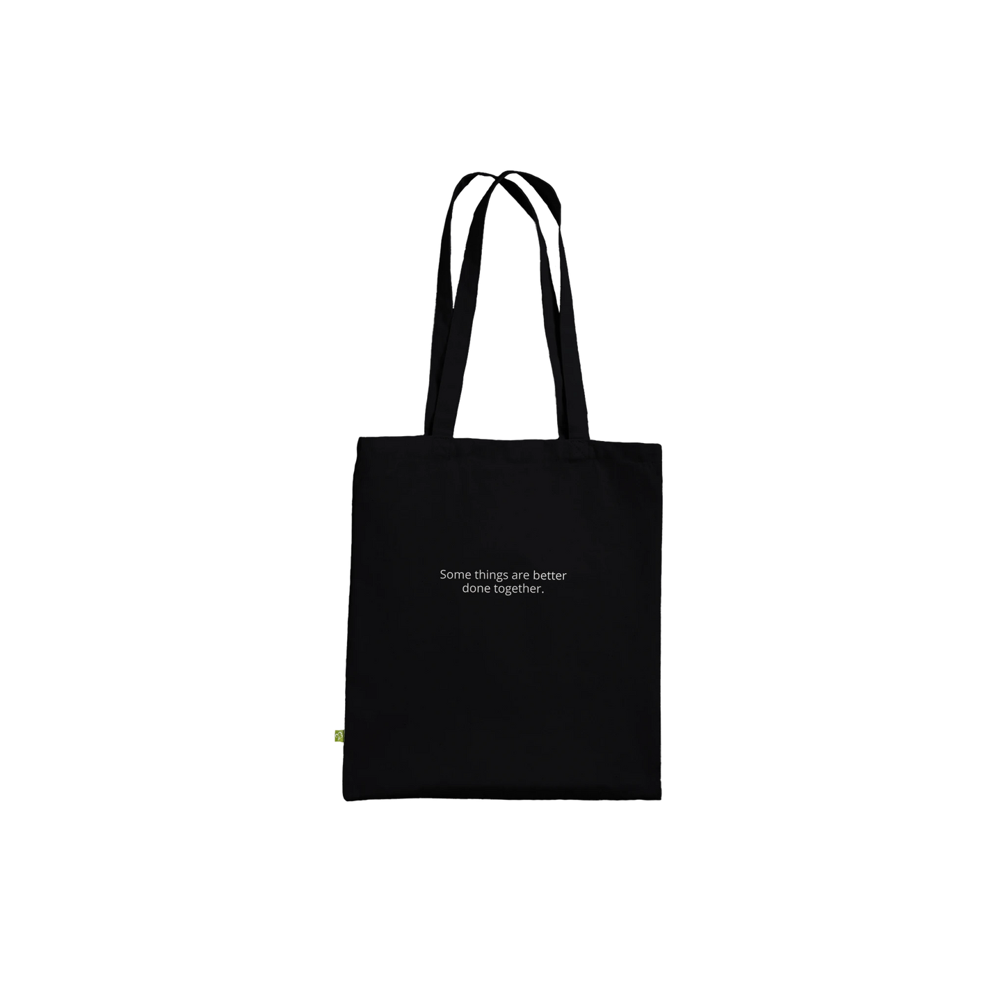 Three Pelicans canvas tote bag, Premium Black, front — fine art photograph of three pelicans standing together in still water at dusk